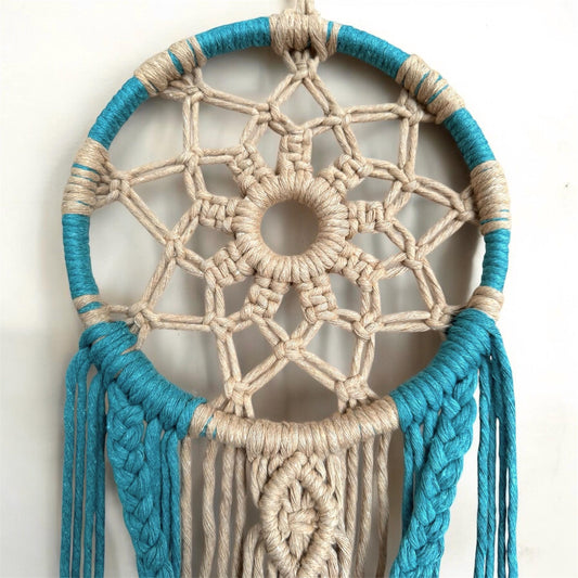 Dreamcatcher with blue and beige cord on a white background