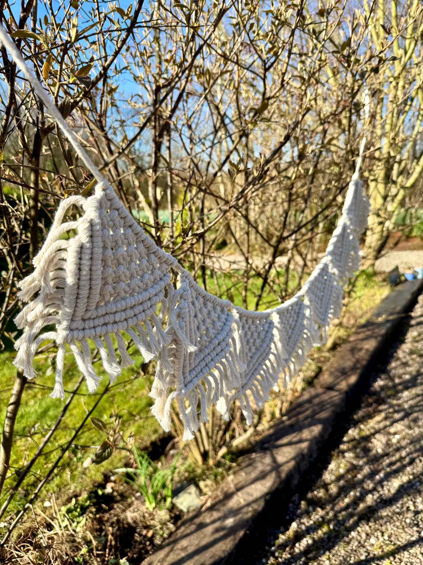 Macrame hanging decor in a garden setting
