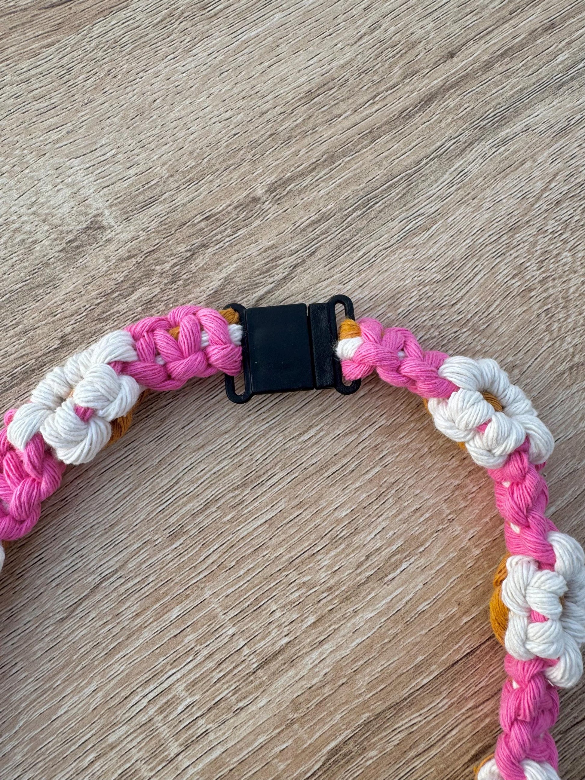 pink, white and yellow daisies macrame lanyard with a black breakaway clip